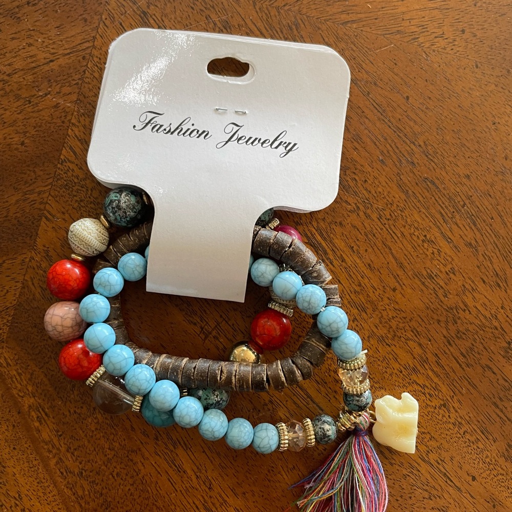 Stackable bracelets with cute little elephants and living trees.
